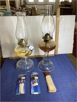 Two vintage oil lamps with extra wicks