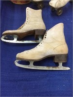 Vintage ice skates and roller skates, with her