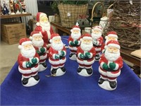 Eight 10 inch plastic Santas and one 13 inch