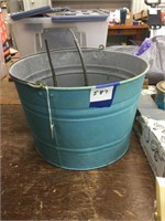 9 inch tall by 12 inch wide metal bucket with