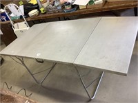 6 ft x 34.5 inch folding metal table.
