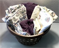 Laundry basket with full-size sheets