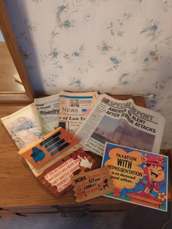 Collection of newspapers and signs