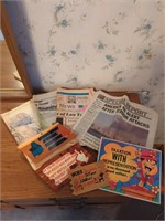 Collection of newspapers and signs