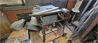 Craftsman table saw on stand.