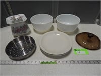 Mixing bowls, strainers, dinner plates, lid and a