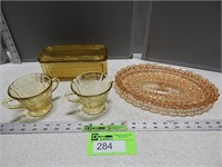 Amber depression glass and a tray