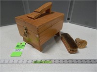 Vintage shoe shine box with a couple brushes