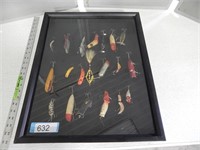 20 Antique fishing lures in a display case; approx