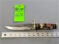 Damascus hunting knife; has been oiled