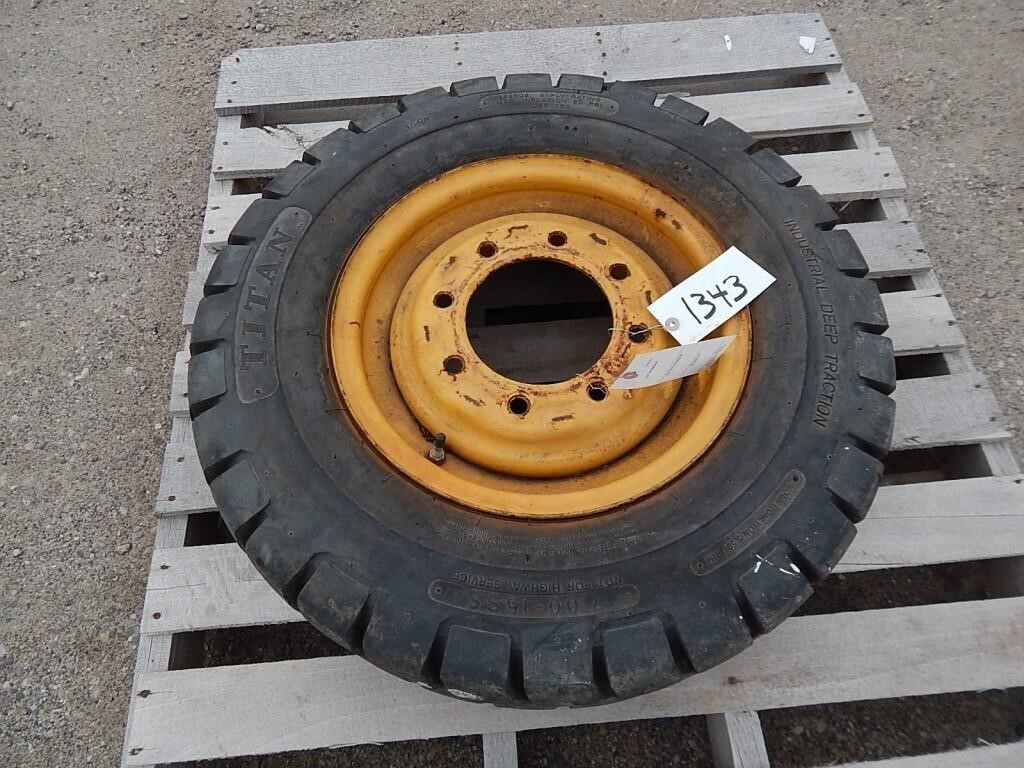 Skid Loader tire on rim; size: 7.00-15SS