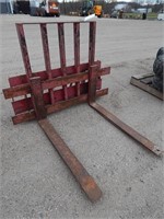 Pallet forks off a Case skid loader