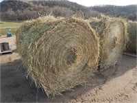 4 Round bales; first crop grassy hay; stored insid
