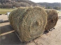 4 Round bales; first crop grassy hay; stored insid
