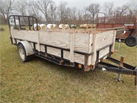 Utility trailer with side rails and drop down ramp