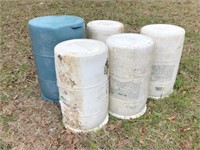 5) plastic barrels -whites had Roundup in them