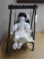 COLLECTIBLE DOLL & CAST IRON DOLL SWING