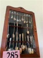 COLLECTION OF SPOONS IN HANGING CASE
