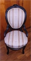 Antique carved walnut parlor chair w/ hip rests,