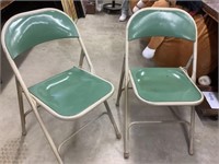 Two metal folding chairs