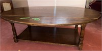 Coffee table with drop leaf sides