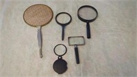 VARIOUS MAGNIFYING GLASSES AND A HAND MIRROR