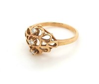 10kt Gold and diamond ring, with an ornate face, s