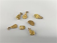 18kt Gold nuggets most of them fixed to loops to b