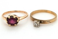 Two 10kt gold rings, 1 has a garnet, other has 3 d