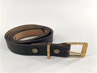Alaskan gold nugget belt buckle with a leather bel