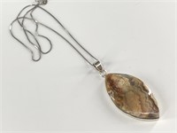 Polished stone pendant on a sterling silver settin
