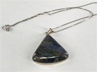 Polished stone on a sterling silver setting and ba