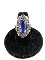 Ring with a large blue stone in center, ornate, si