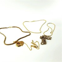 Large assortment of gold tone chains and pendants