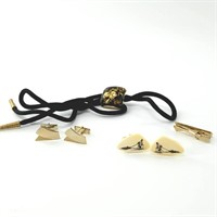 Men's ivory cufflinks, a bolo tie with gold flakes