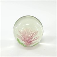 Round glass paperweight with a flower  about 2.5"