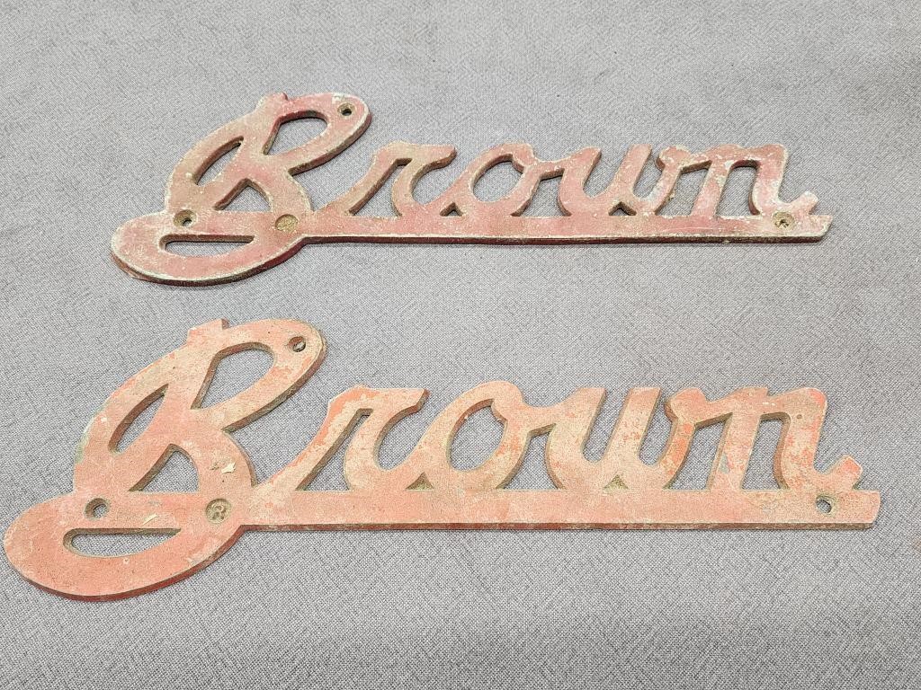 2 Brown Aluminum emblems.   12.5" L.  Look at the