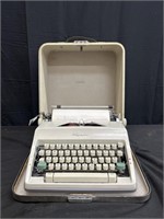 Vintage Olympia Deluxe portable typewriter & case