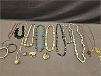 11 NECKLACES, 1 RING, 4 BANGLES, 1 PAIR OF