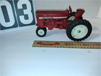 Antique metal International red toy tractor.