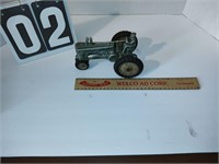 Antique metal green toy tractor.