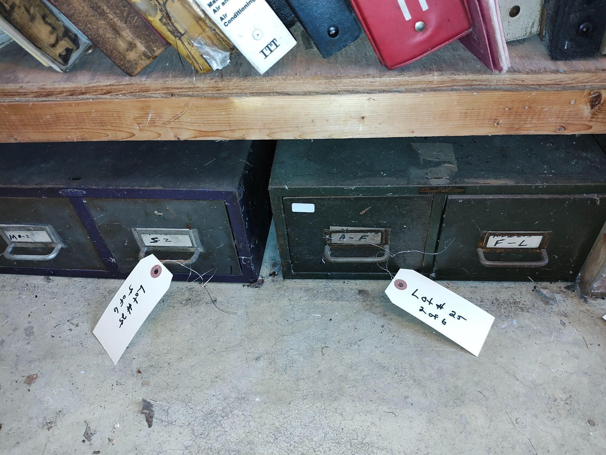 Old electric heater with filing cabinets.