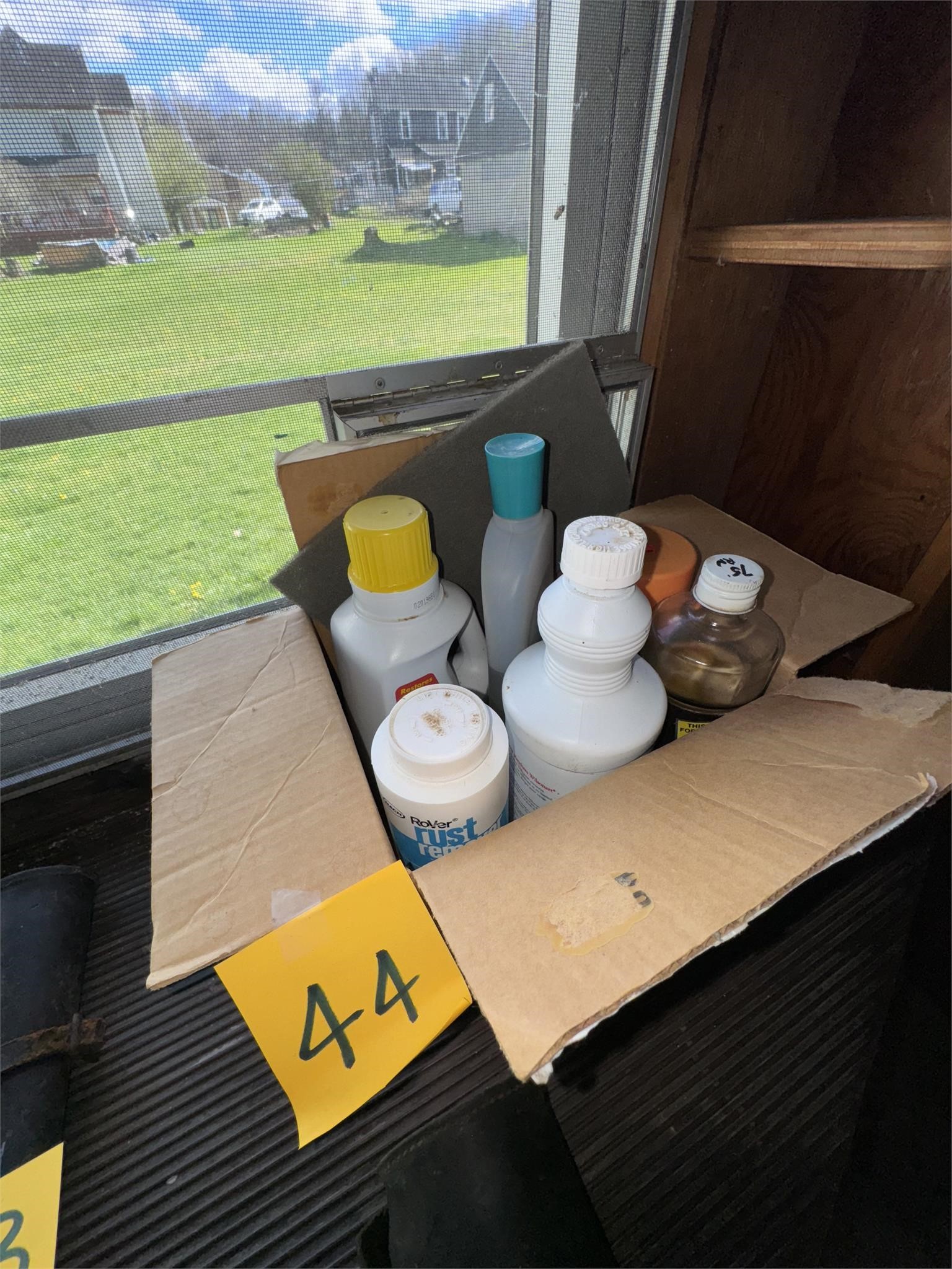 Box of cleaners, oil, etc. item