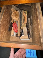 Drawer full of items to include hatchet item