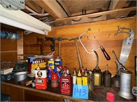 Shelving unit of oil, cans,+ hammers on wall only