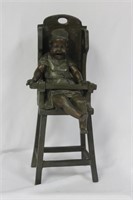 A Bronze Child on a High Chair by Steiner