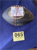 Certificate of authenticity signed football by