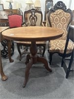 Wooden oval-shaped table