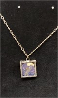 Purple pressed flower sterling silver necklace.