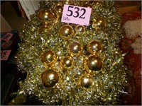 GOLD COLORED ORNAMENTS AND GARLAND
